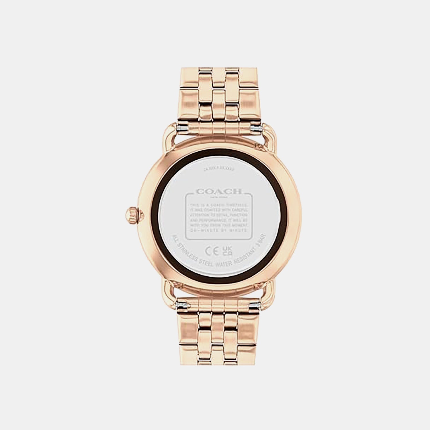Coach rose gold women's watch caseback showing stainless steel case back with engraved Coach branding