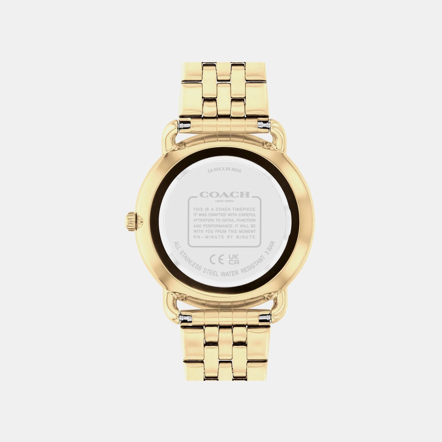 Coach watch caseback showing engraved brand details and watch specifications on white background