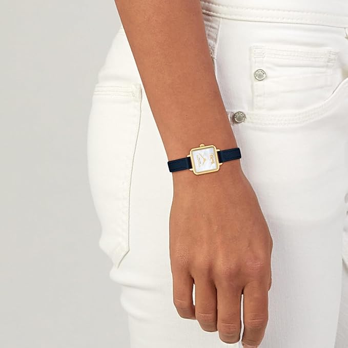 Coach Cass watch worn on wrist with blue leather strap and mother of pearl dial