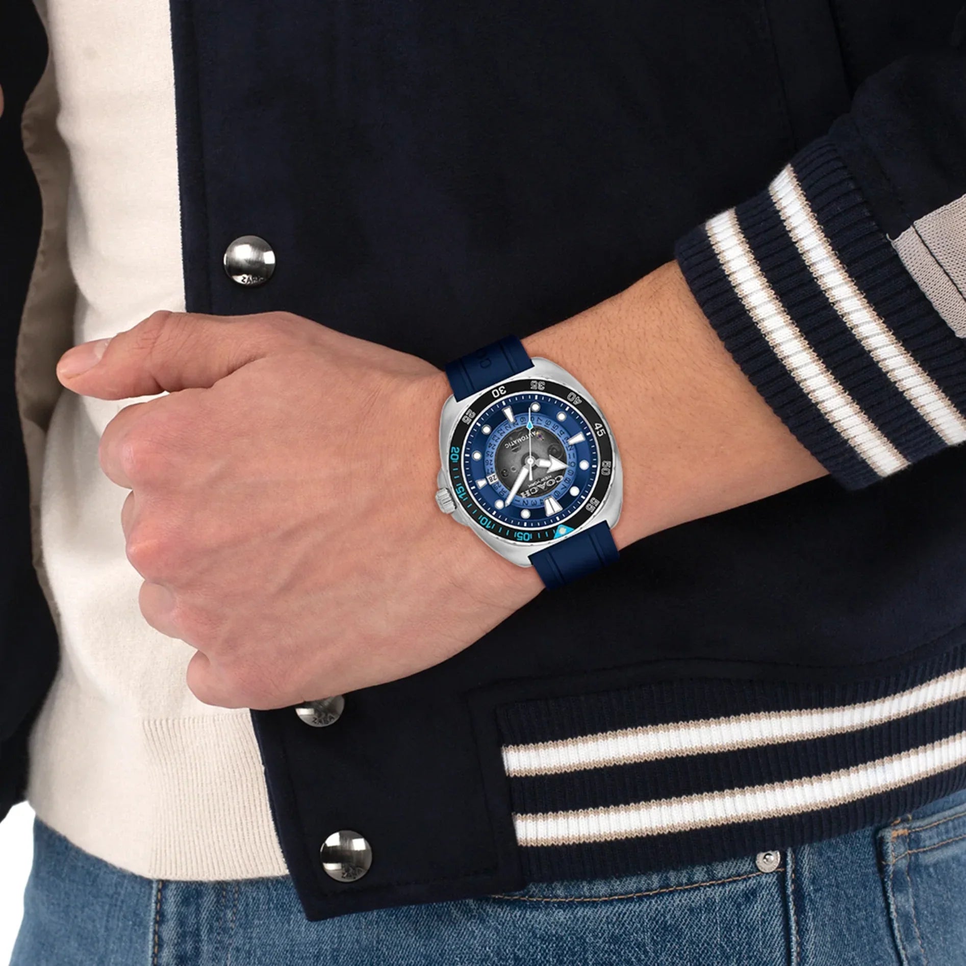 COACH Charter blue dial automatic watch worn on wrist with navy strap