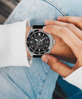 COACH Charter automatic watch worn on wrist, showing black dial and stainless steel case