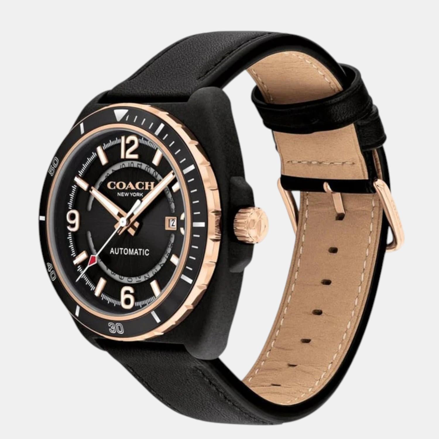 Coach Charter watch showing black leather strap and tan leather interior with rose gold hardware
