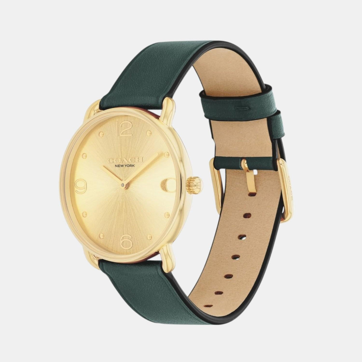 Coach Elliot watch side view showing gold case, champagne dial, and dark teal leather strap