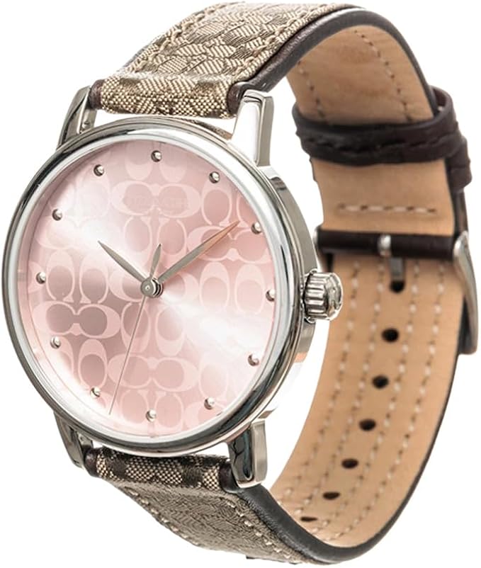 Coach Grand watch side view showing silver case, interchangeable brown leather strap, and pink patterned dial
