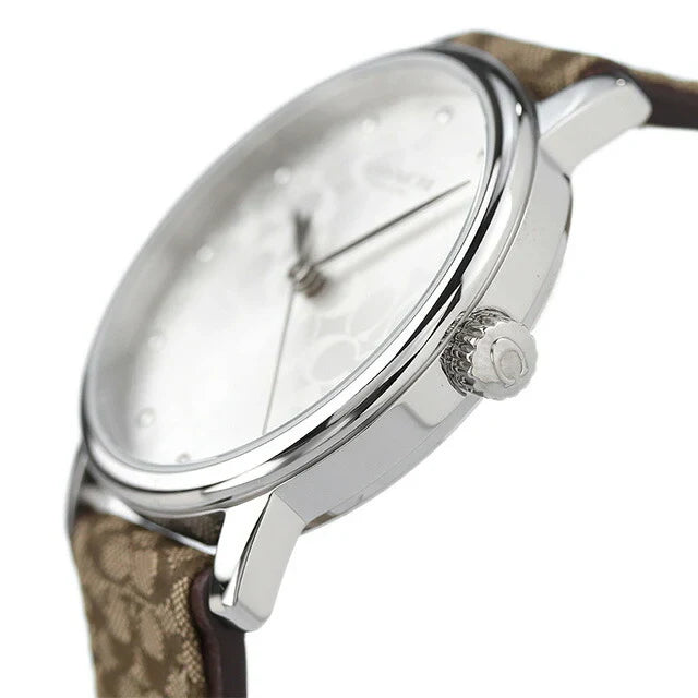 Side view of Coach Grand watch with silver-tone case and brown leather strap detail