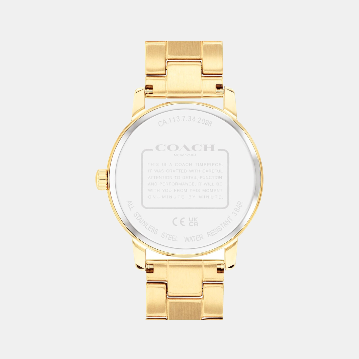 Coach Grand watch caseback showing gold-tone stainless steel back with Coach branding and specifications