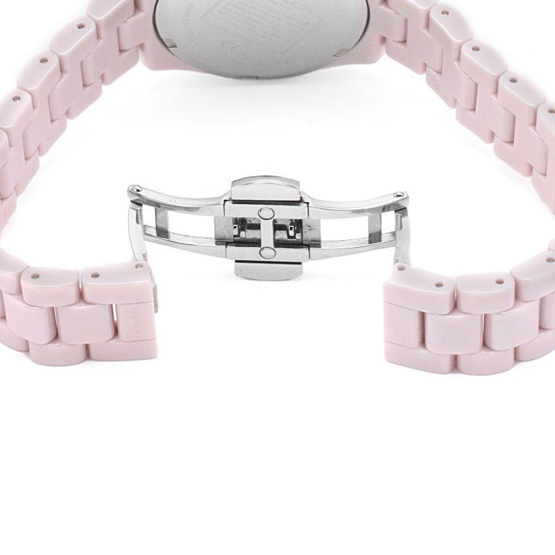 Coach Preston ceramic bracelet clasp detail showing silver-tone fold-over closure mechanism