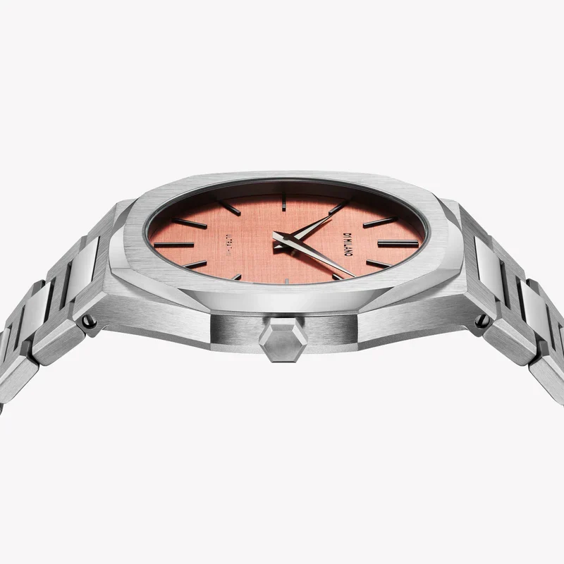 D1 Milano watch dial detail showing rose gold face with minimalist hour markers