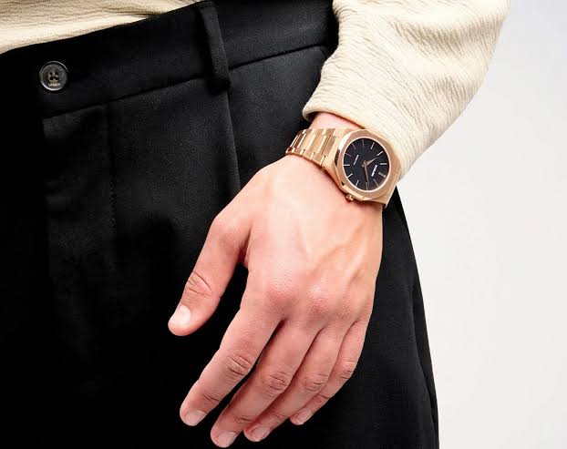 D1 Milano Ultra Thin 40mm rose-gold watch worn on wrist with black dial visible