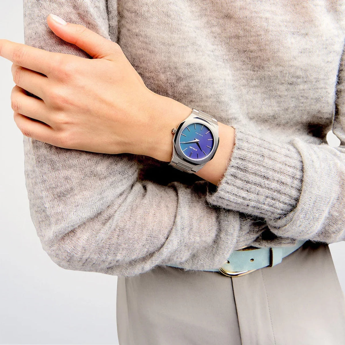 D1 Milano UTBJ43 ultra thin watch on wrist with gradient blue-teal dial and silver bracelet