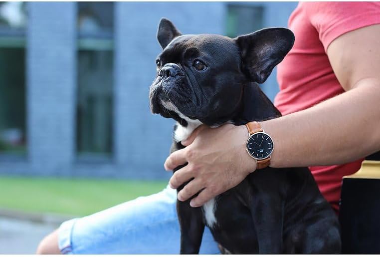 Daniel Wellington Classic Black Durham 36mm watch worn on wrist with rose gold case and black dial