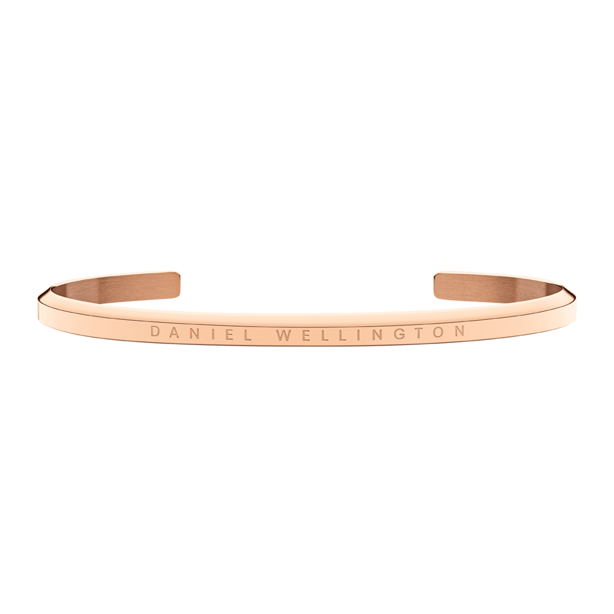 Rose gold cuff bracelet with Daniel Wellington engraved text, shown flat against green background