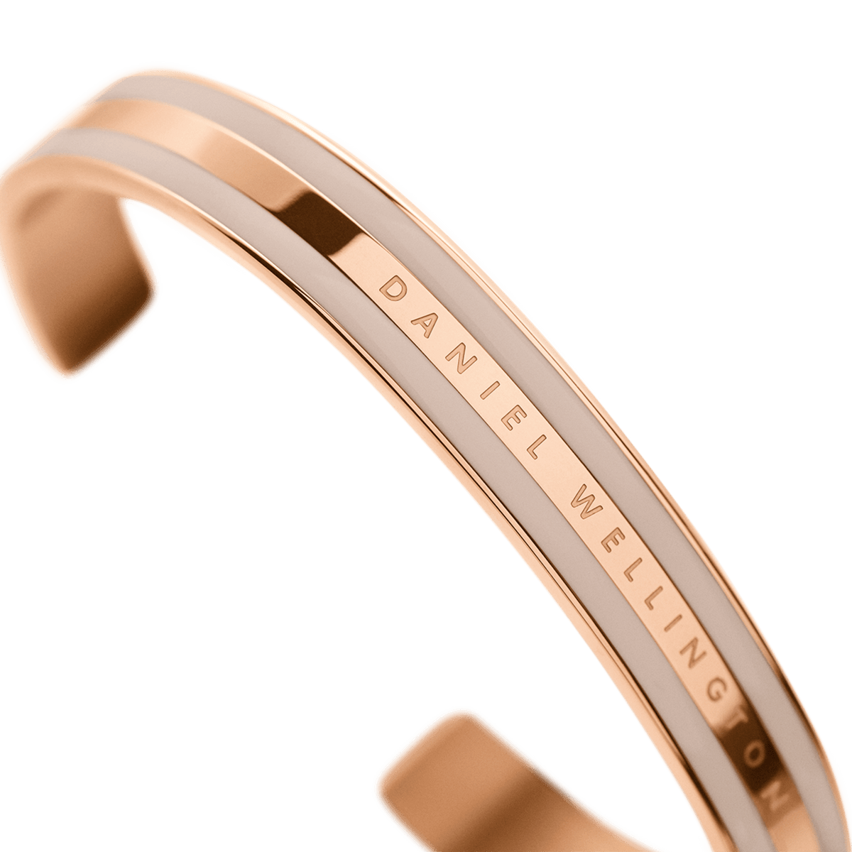 Angled view of Daniel Wellington Classic rose gold cuff bracelet with engraved text