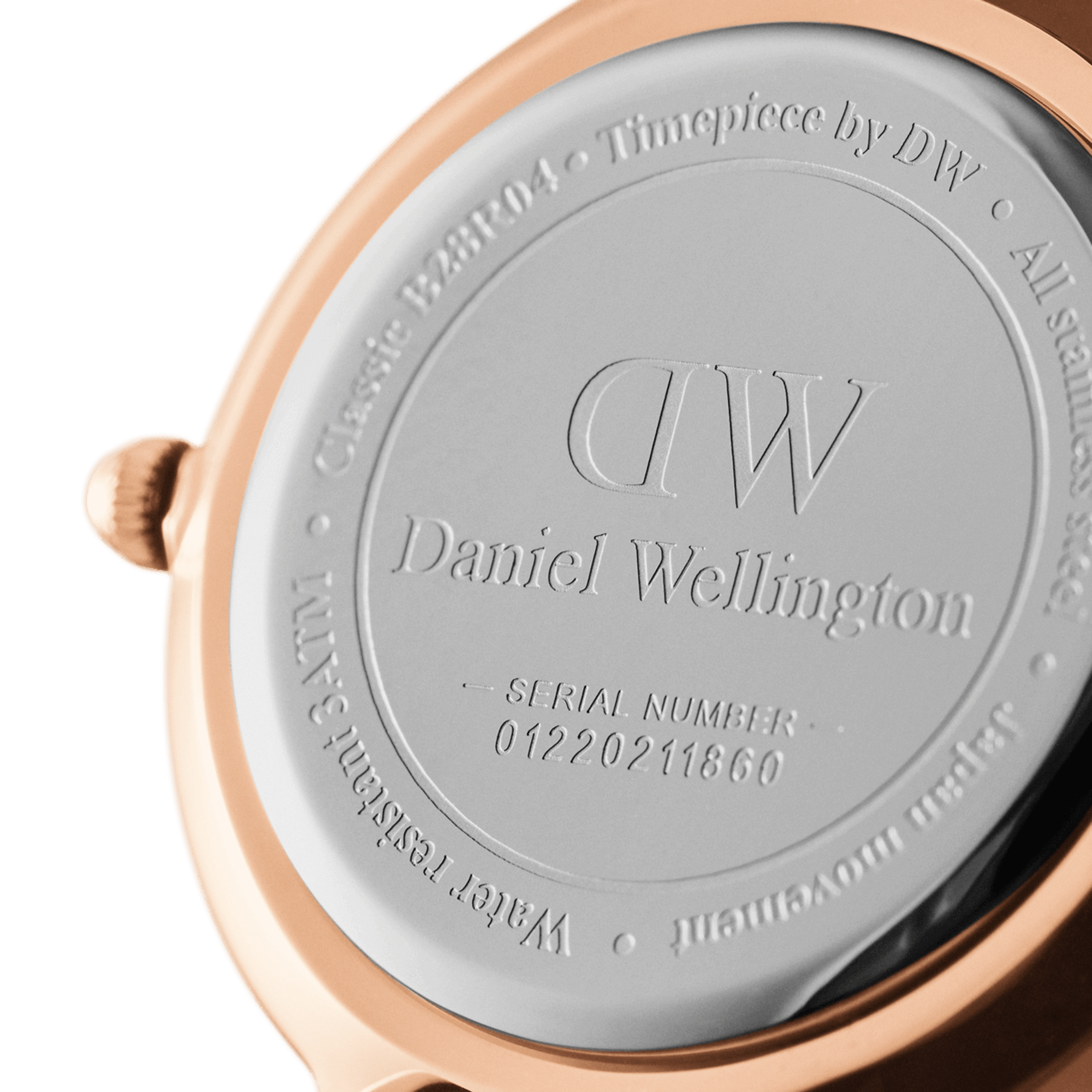 Rose gold caseback engraved with Daniel Wellington branding and serial number