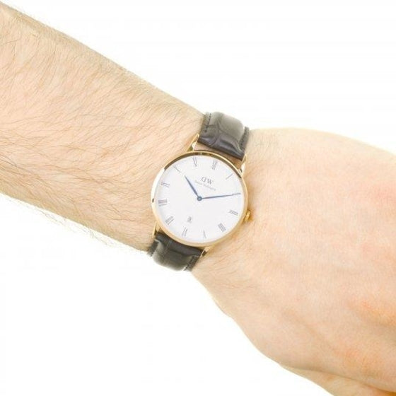 Dapper Reading 38mm watch worn on wrist showing gold case and black leather strap