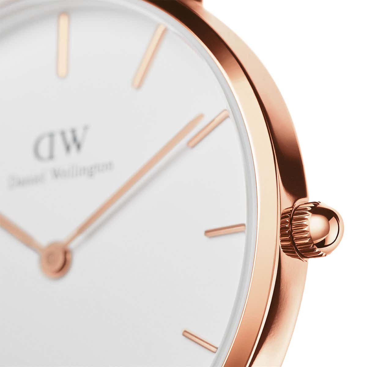 Close-up of Daniel Wellington Petite Bristol dial with white face and rose gold indices and hands