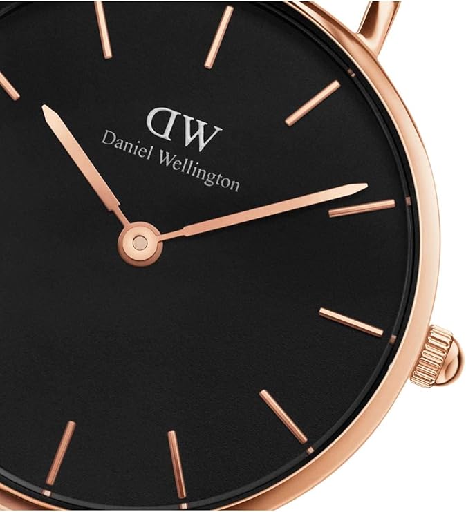 Close-up of Daniel Wellington Classic Petite Durham dial featuring black face, rose gold indexes and hands