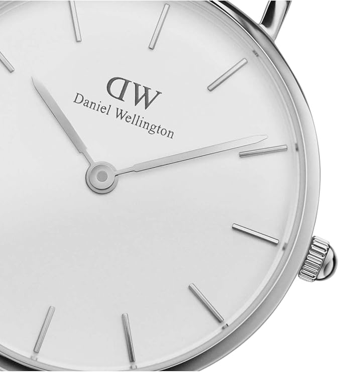 Close-up of white dial showing Daniel Wellington branding and minimalist index markers
