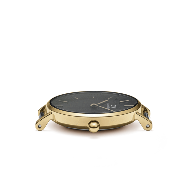 Side profile view of watch case showing gold-plated metal body and brown leather strap segment