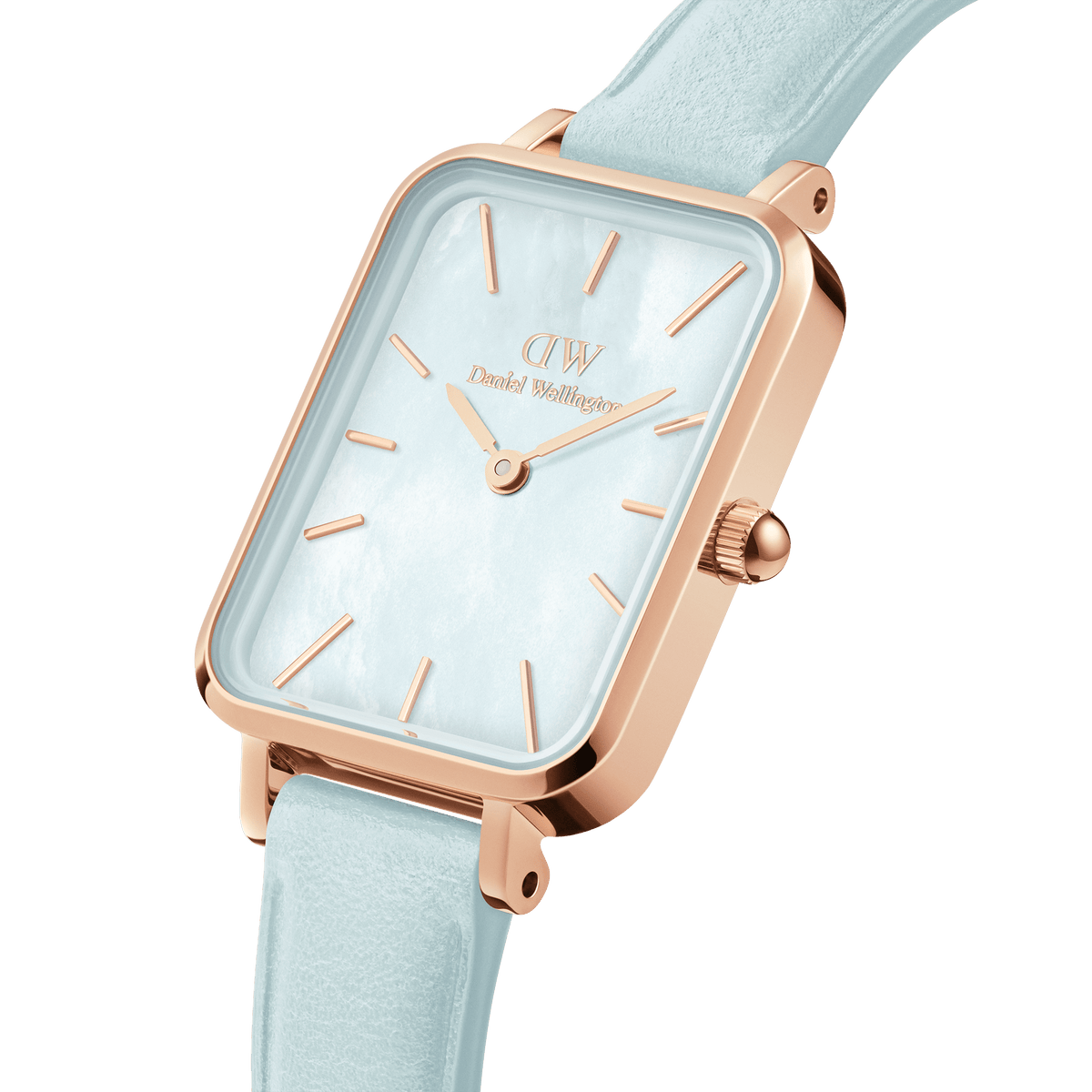 Daniel Wellington Quadro watch at angle showing rose gold case, white dial with rose gold hands, and light blue leather strap