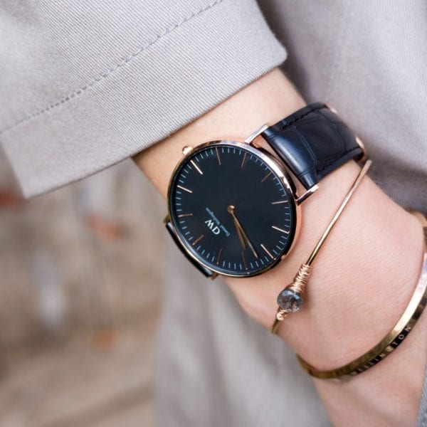 Daniel Wellington Reading 36mm watch worn on wrist with black leather strap and rose gold case