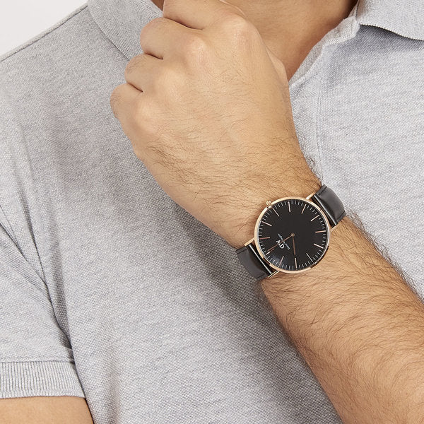 Daniel Wellington Sheffield 40mm watch worn on wrist with black dial and rose gold case