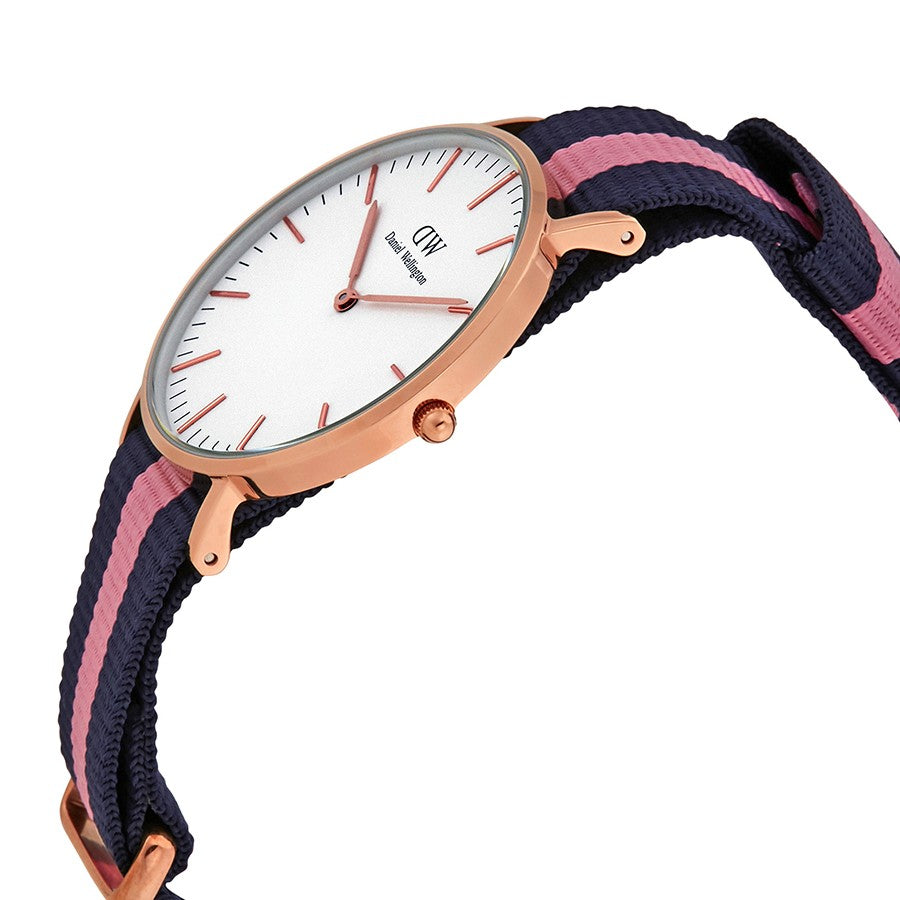 Side angle view of Winchester watch showing rose gold case and navy pink striped strap