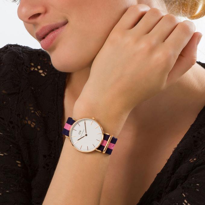 Winchester 36mm watch worn on wrist showing white dial and striped fabric band