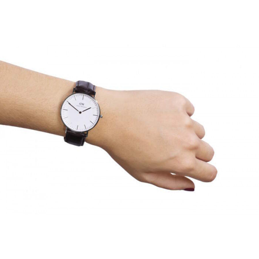 Daniel Wellington York 36mm white dial watch worn on wrist with black leather strap