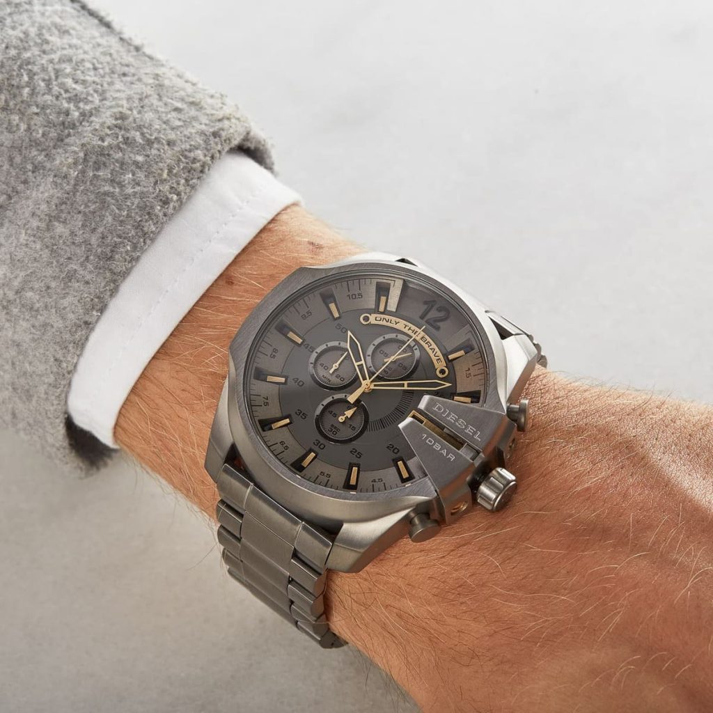 Diesel Mega Chief chronograph watch worn on wrist with gunmetal case and black dial
