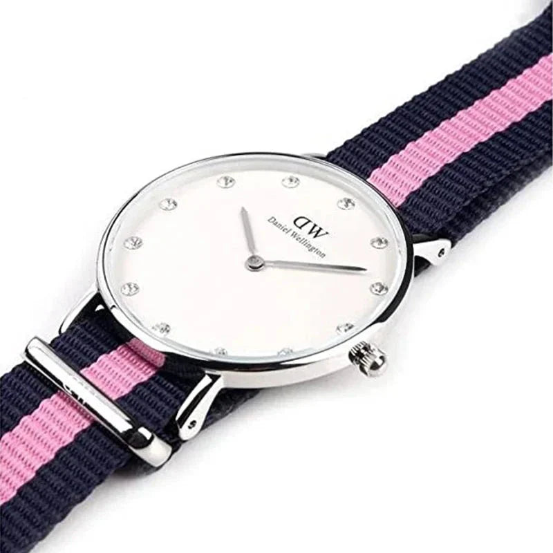 Classy Winchester 26mm watch on wrist with navy and pink striped NATO strap