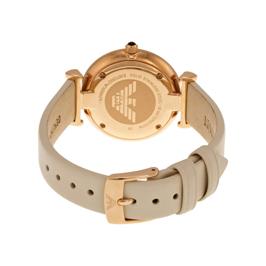 Emporio Armani watch caseback showing engraved eagle logo and white leather strap details