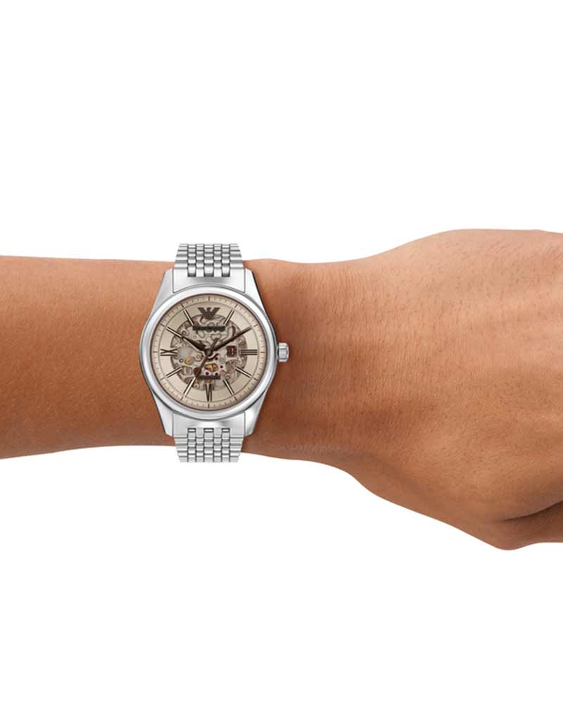 Emporio Armani Antonio skeleton watch worn on wrist with stainless steel bracelet
