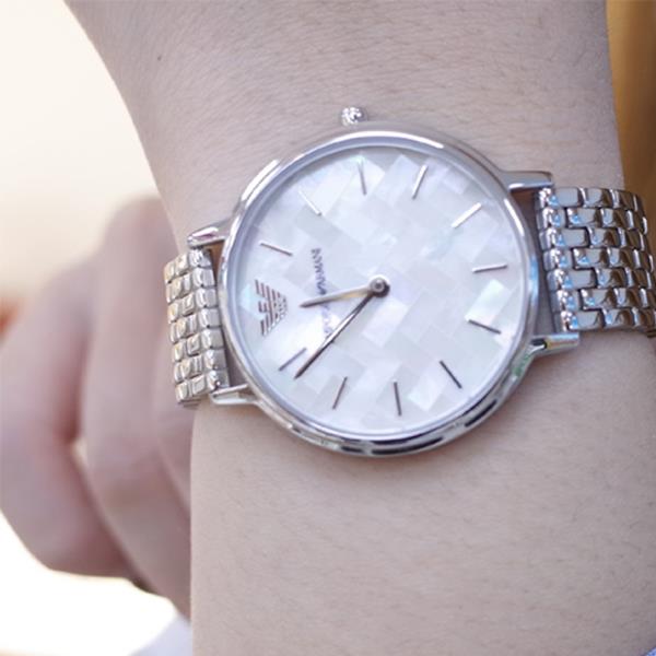 Emporio Armani AR11112 watch worn on wrist with mother of pearl dial and steel bracelet