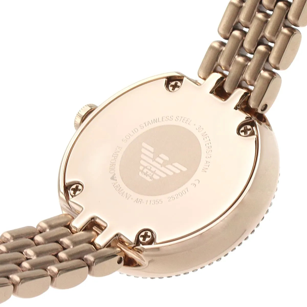 Detailed view of rose gold case with crystal bezel and link bracelet