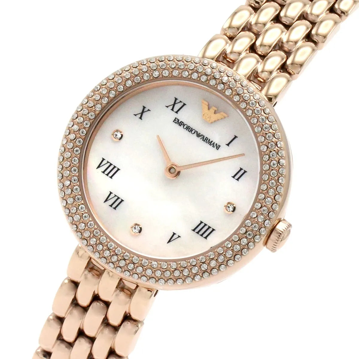 Watch dial detail showing white face, Roman numerals, and crystal-set bezel