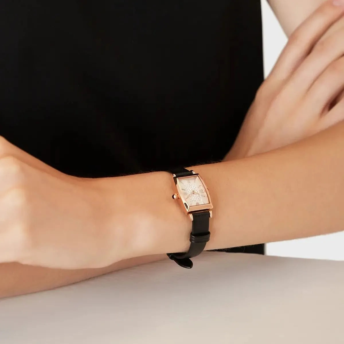 Emporio Armani AR11408 watch on wrist showing rose gold case and pave crystal dial