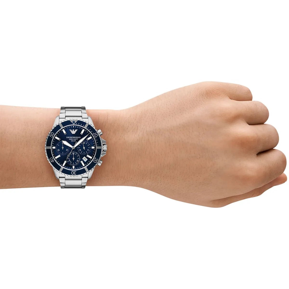 Emporio Armani AR11681 solar chronograph worn on wrist with navy dial and stainless steel bracelet