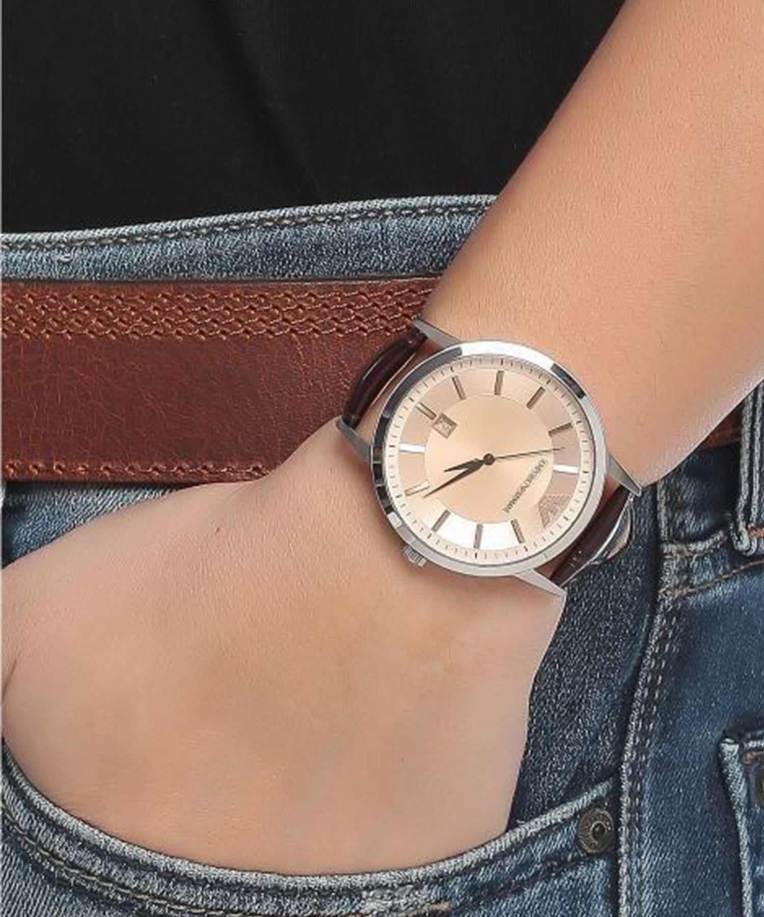 AR2427 watch worn on wrist showing cream dial and brown leather strap in use