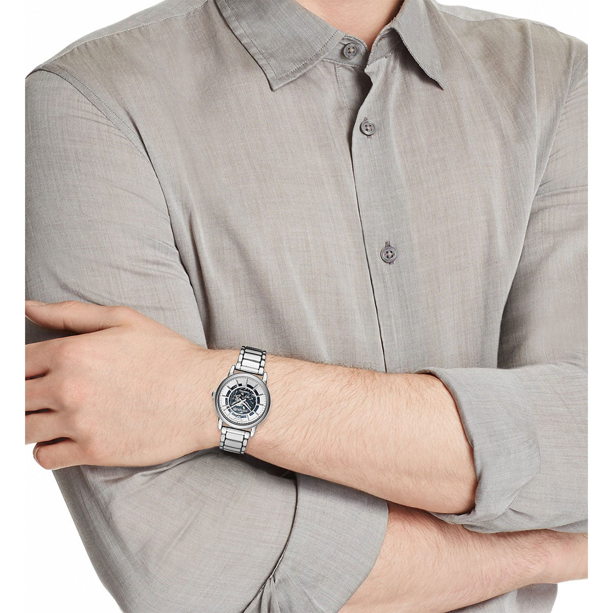 Emporio Armani AR60006 skeleton watch worn on wrist, on-wrist lifestyle shot