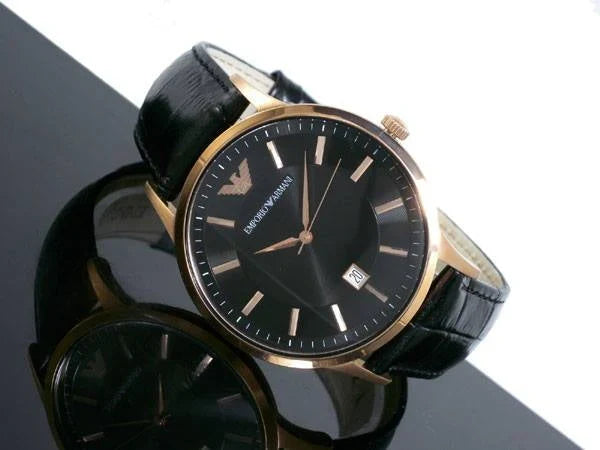 Emporio Armani AR9022 watch displayed on dark surface showing black dial and rose gold case detail