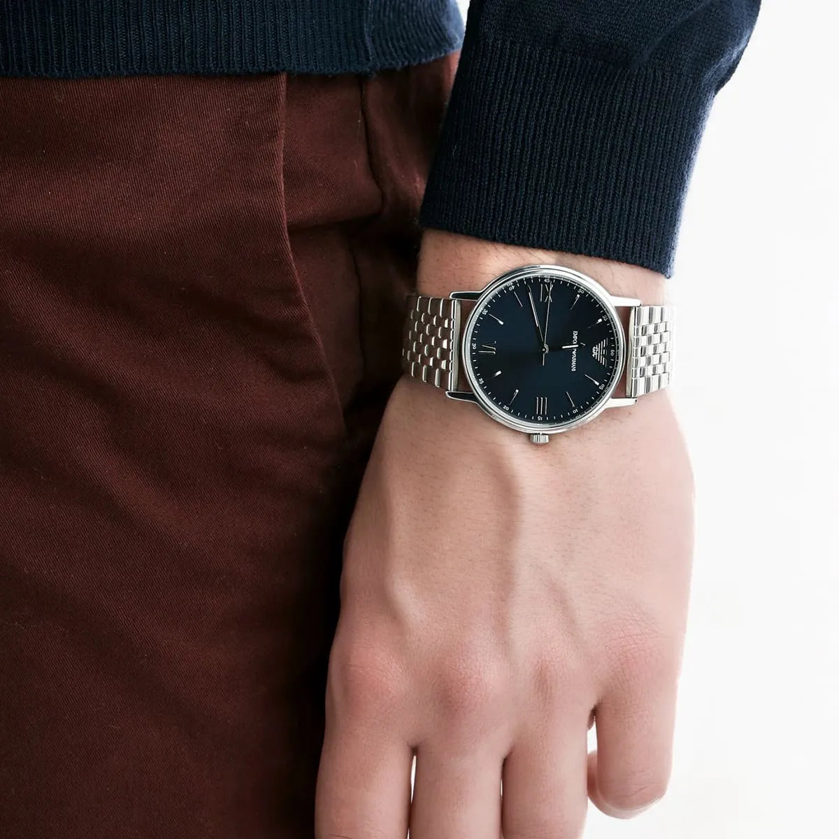 Emporio Armani Kappa AR80010 watch worn on wrist showing blue dial and silver metal bracelet