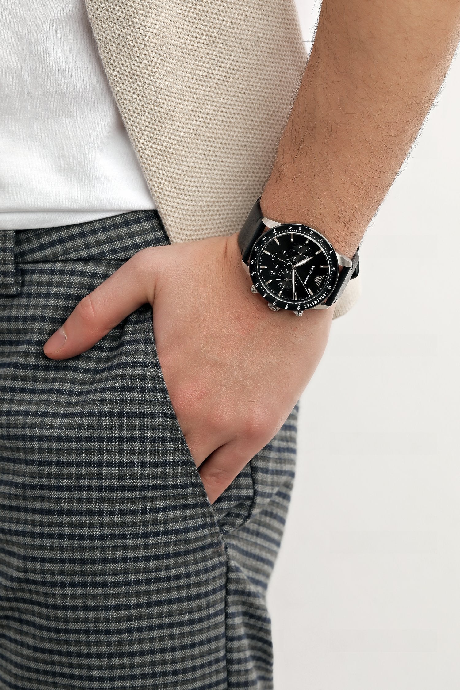 Emporio Armani Mario chronograph watch worn on wrist with black dial and leather strap
