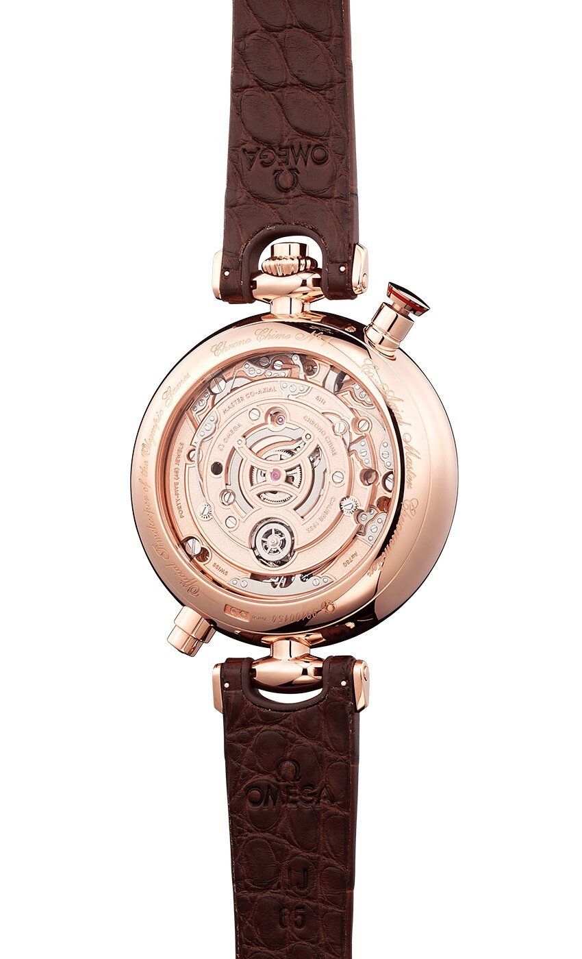 Emporio Armani Meccanico caseback showing automatic skeleton movement with rose gold rotor and crown