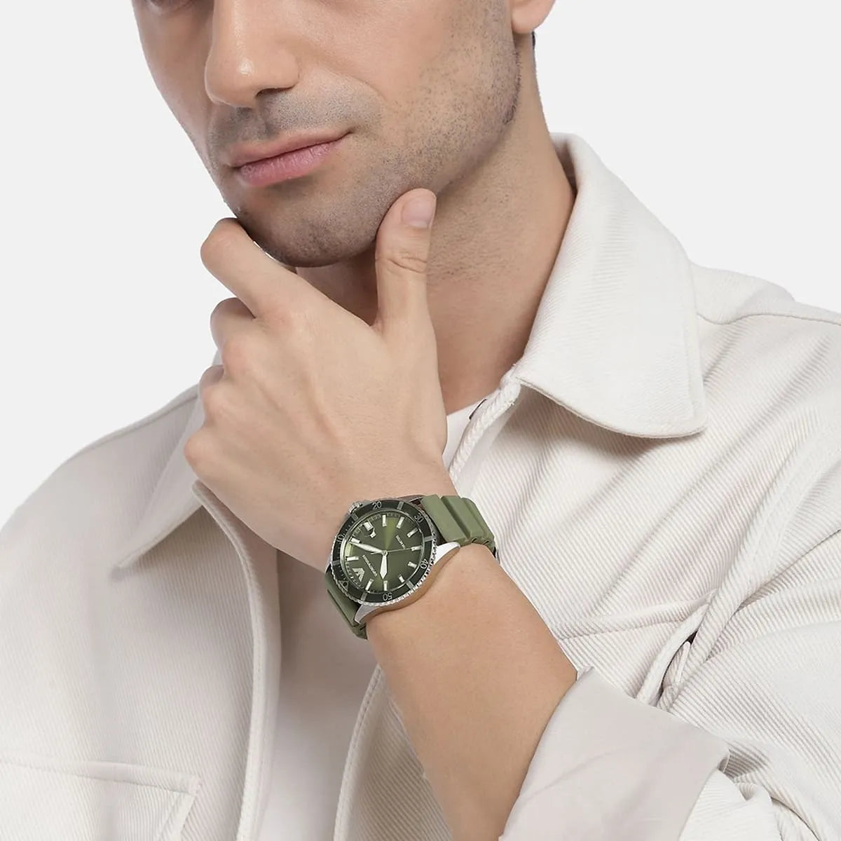 Emporio Armani World Explorer AR11638 watch worn on wrist showing green dial and strap