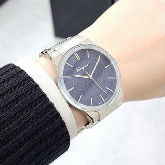 Ferragamo Salvatore men's watch on wrist showing sapphire blue dial and silver strap