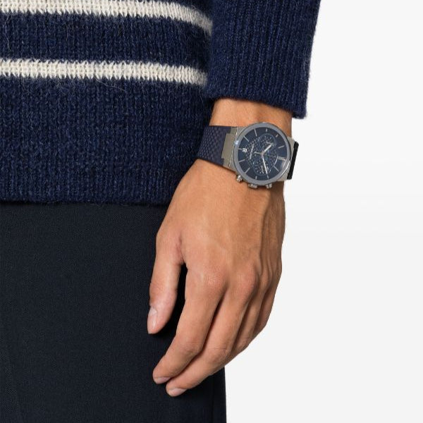 Ferragamo chronograph watch worn on wrist with navy strap