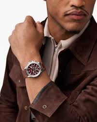 Fossil Bannon burgundy dial watch worn on wrist with stainless steel case