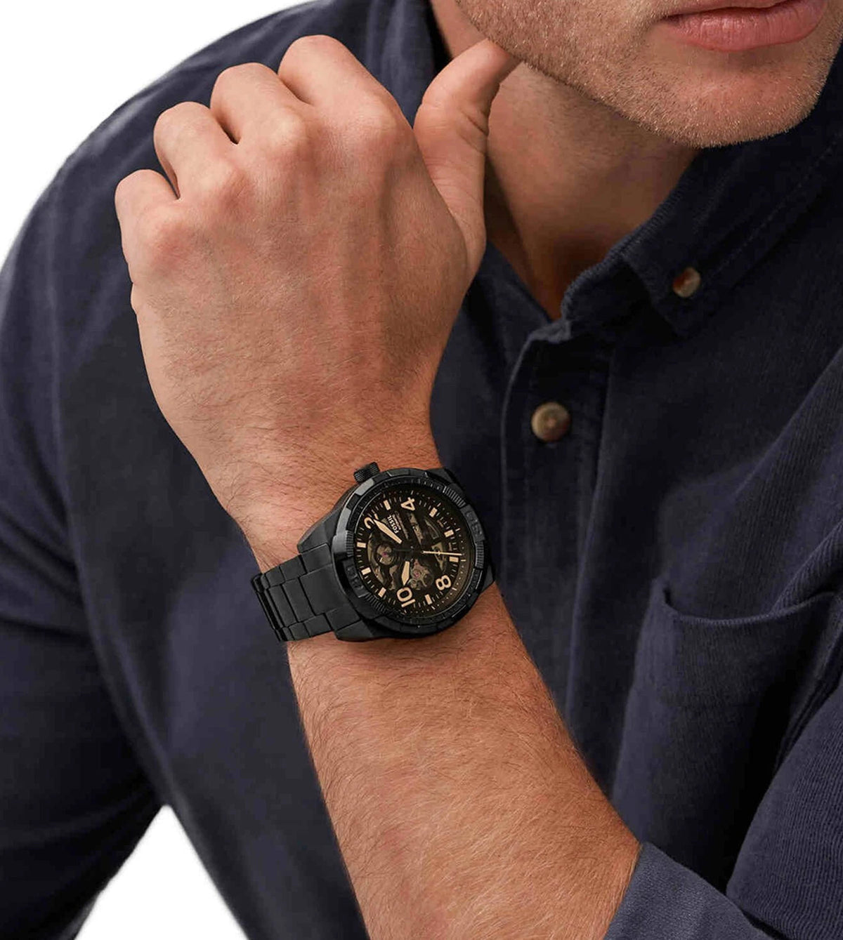 Fossil Bronson ME3256 automatic watch worn on wrist showing skeleton dial with gold accents