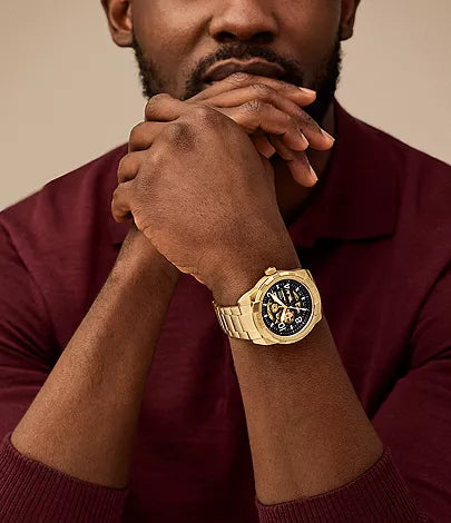 Fossil Bronson ME3257 gold skeleton watch worn on wrist
